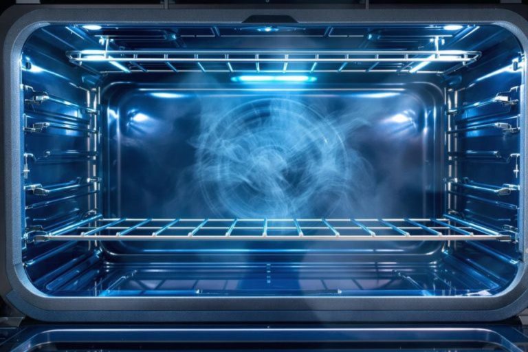An oven emitting smoke, indicating a potential malfunction, highlighting the need for appliance repair services.