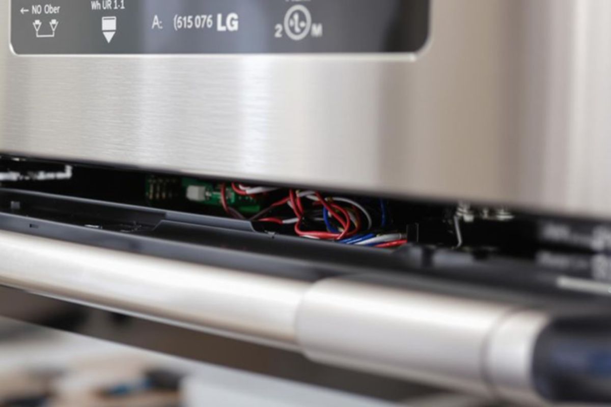 Close-up of a stainless steel oven featuring a wire, highlighting details relevant to appliance repair service.